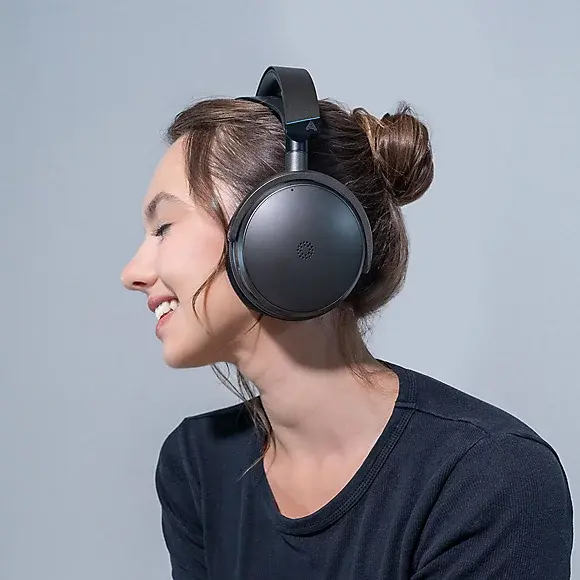 Audeze-2-Headset-woman-wearing-headset-hero-10.webp